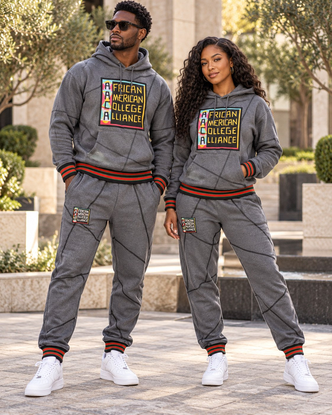 Male and female models wearing this matching AACA Logo hoodie and joggers