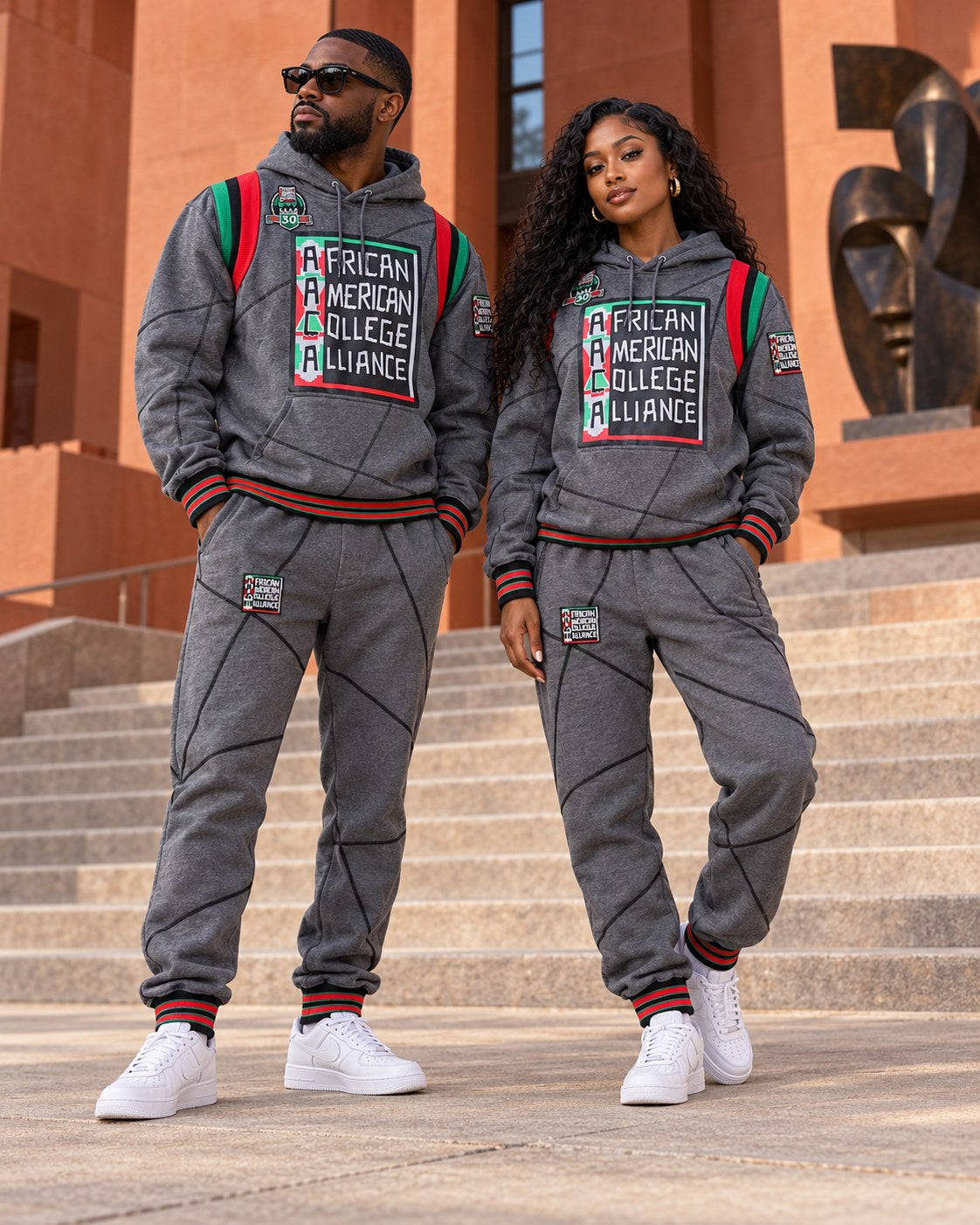Male and female models wearing this matching AACA Logo hoodie and joggers