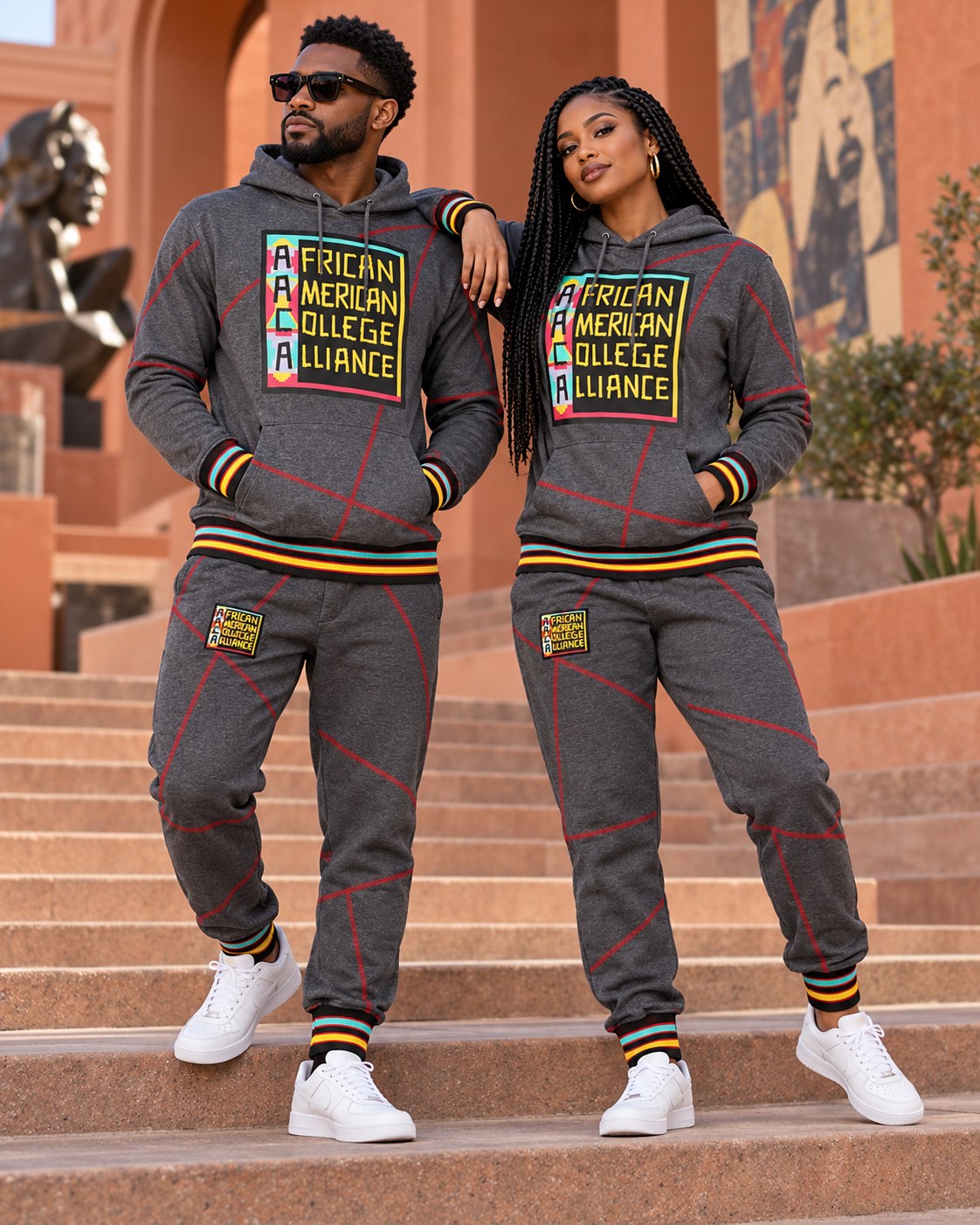 Male and female models wearing this matching AACA Logo hoodie and joggers