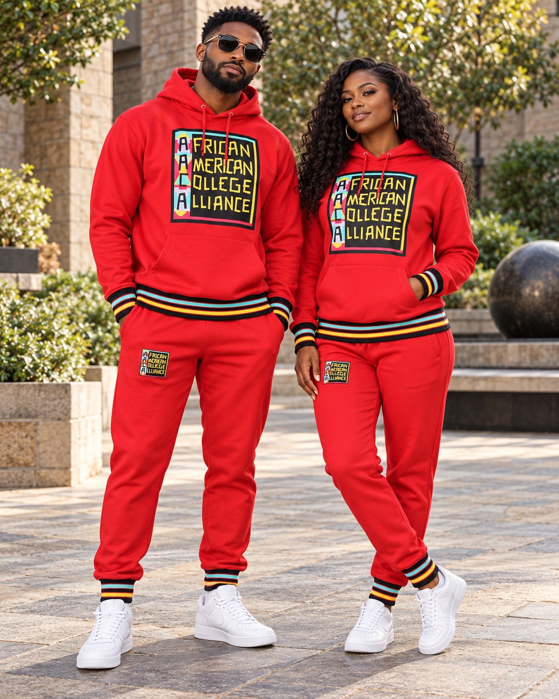 Male and female models wearing this matching AACA Logo hoodie and joggers